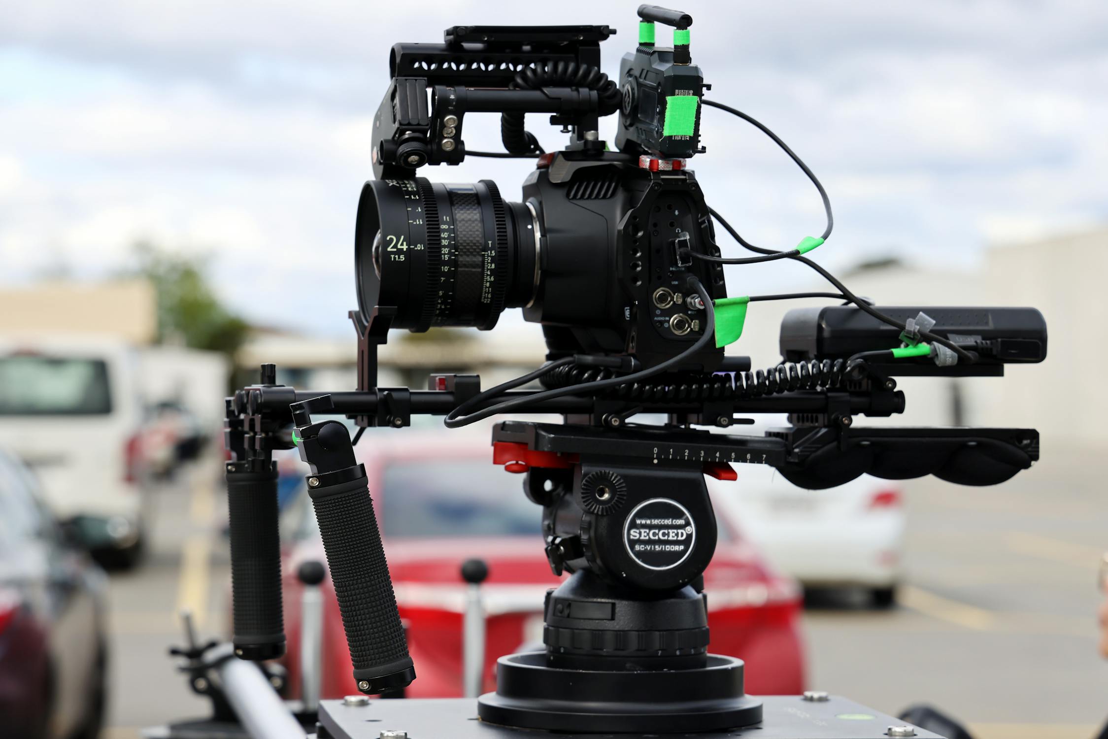 videographer setting up camera rig on location