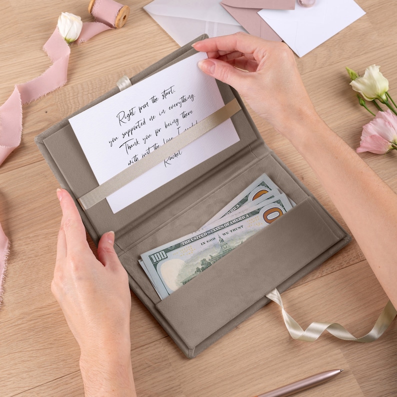 cash tip envelope handed to wedding videographer