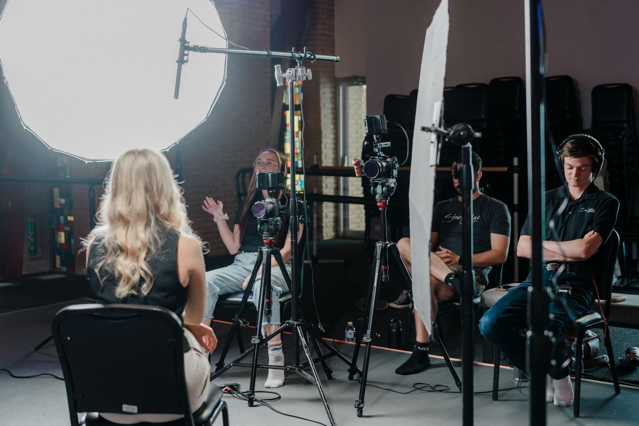 customer interviewed on camera with softbox lighting