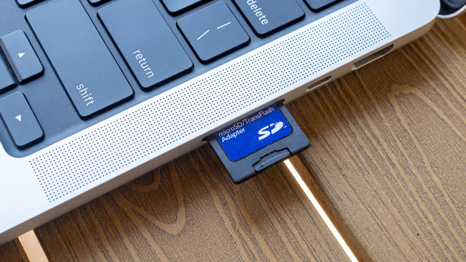 memory cards and laptop on venue table