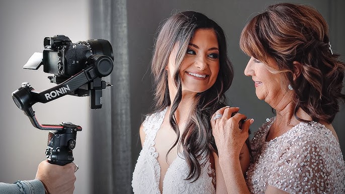 solo wedding videographer with gimbal filming reception
