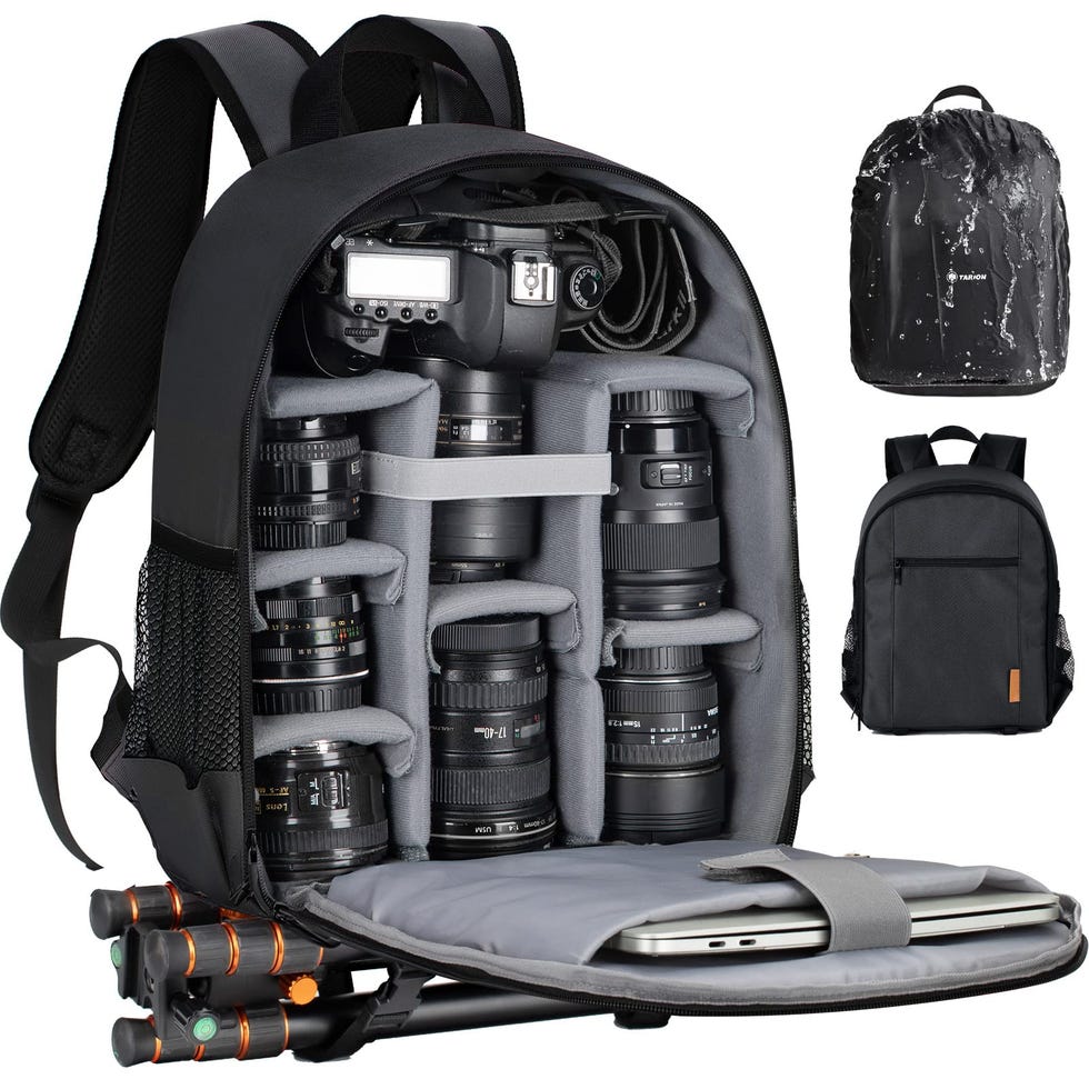 videographer packing camera gear into travel case at airport