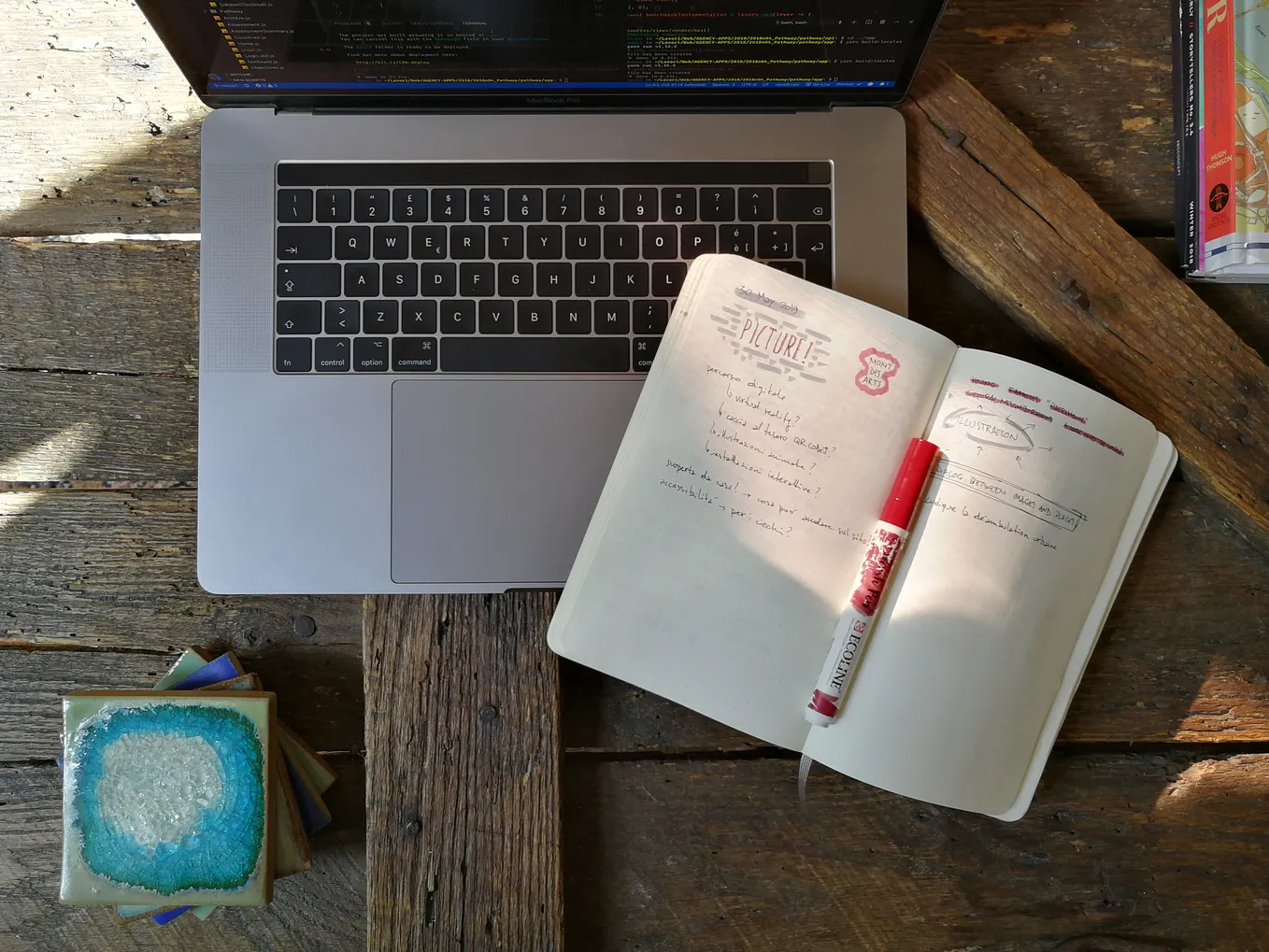 client reviewing rough cut on laptop with notepad