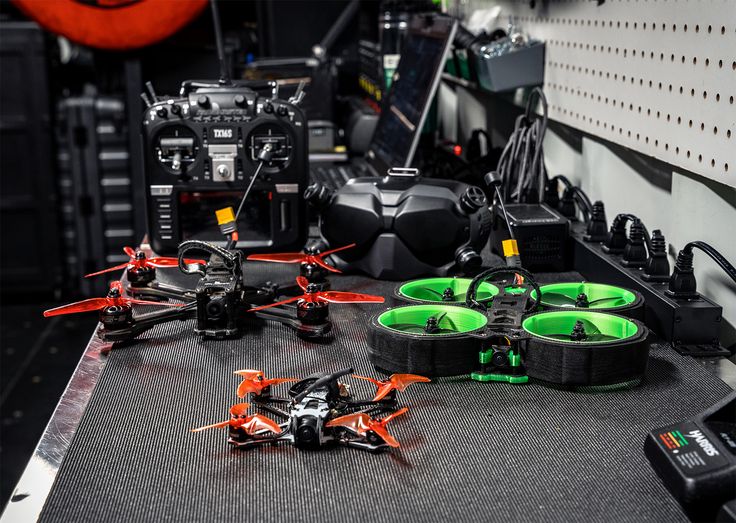 custom built fpv racing drone on table with tools