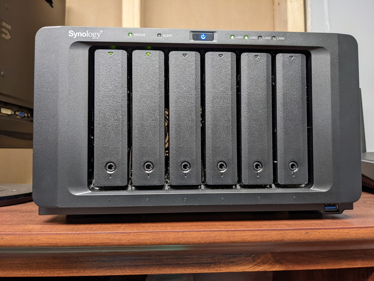 Synology NAS with external drives on a shelf