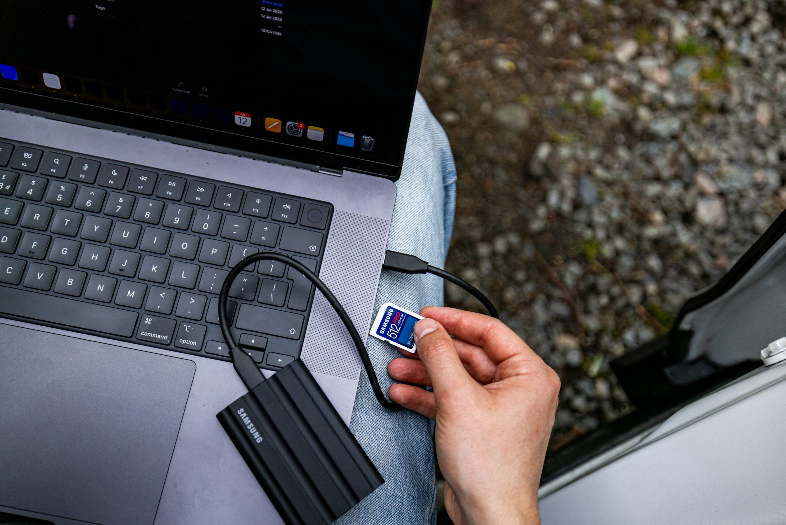 videographer offloading memory cards to hard drives