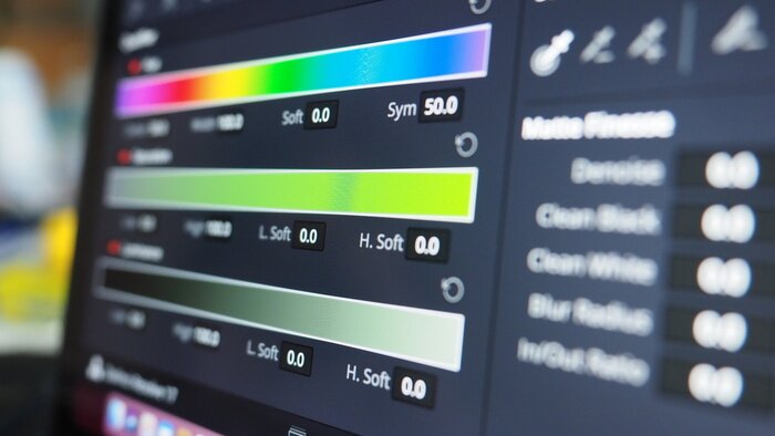 colorist grading music video on calibrated monitor