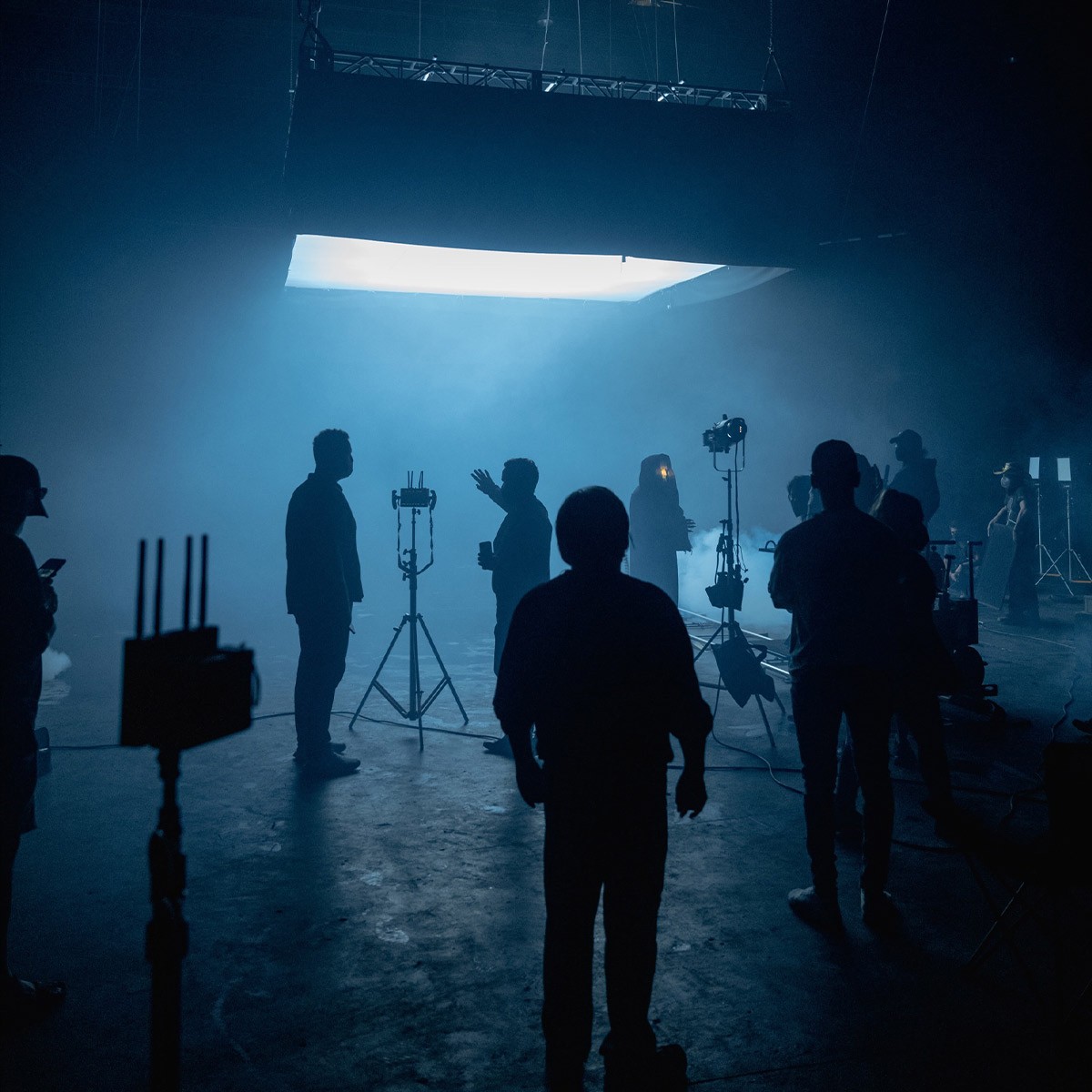 film crew resetting lights between commercial shoot setups