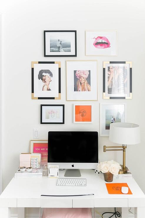 style frames pinned above designer desk